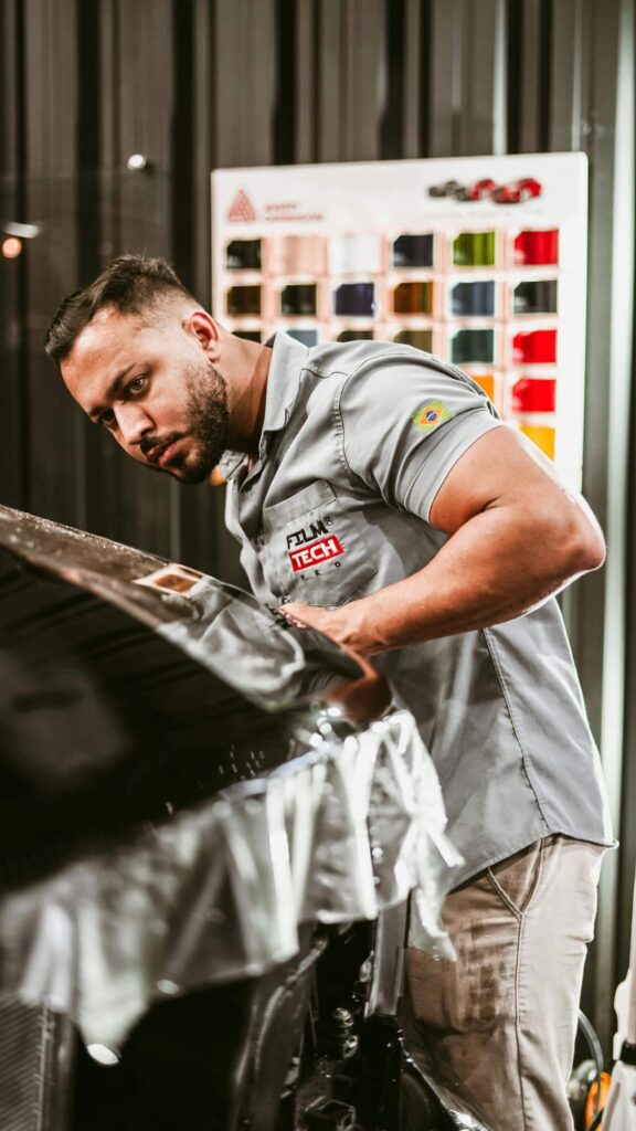 professional detailer installing clear bra