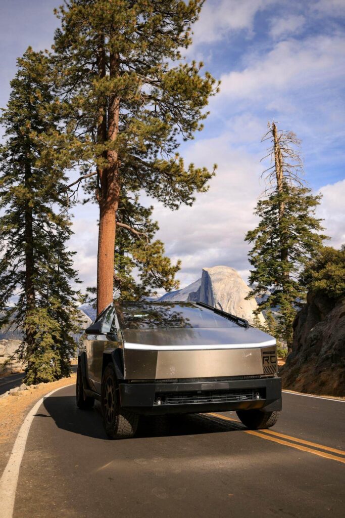 tesla cybertruck has smudges and bug splatter from driving on a remote mountain road