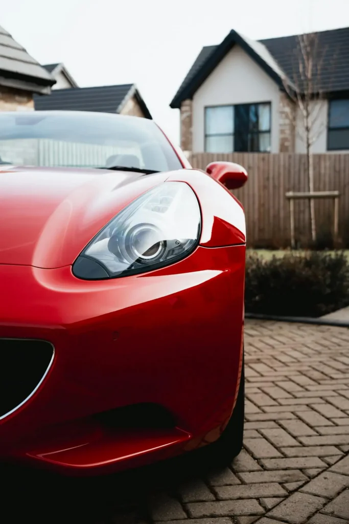 Red sports car protected with film from XPEL, LLumar, or Ceramic Pro
